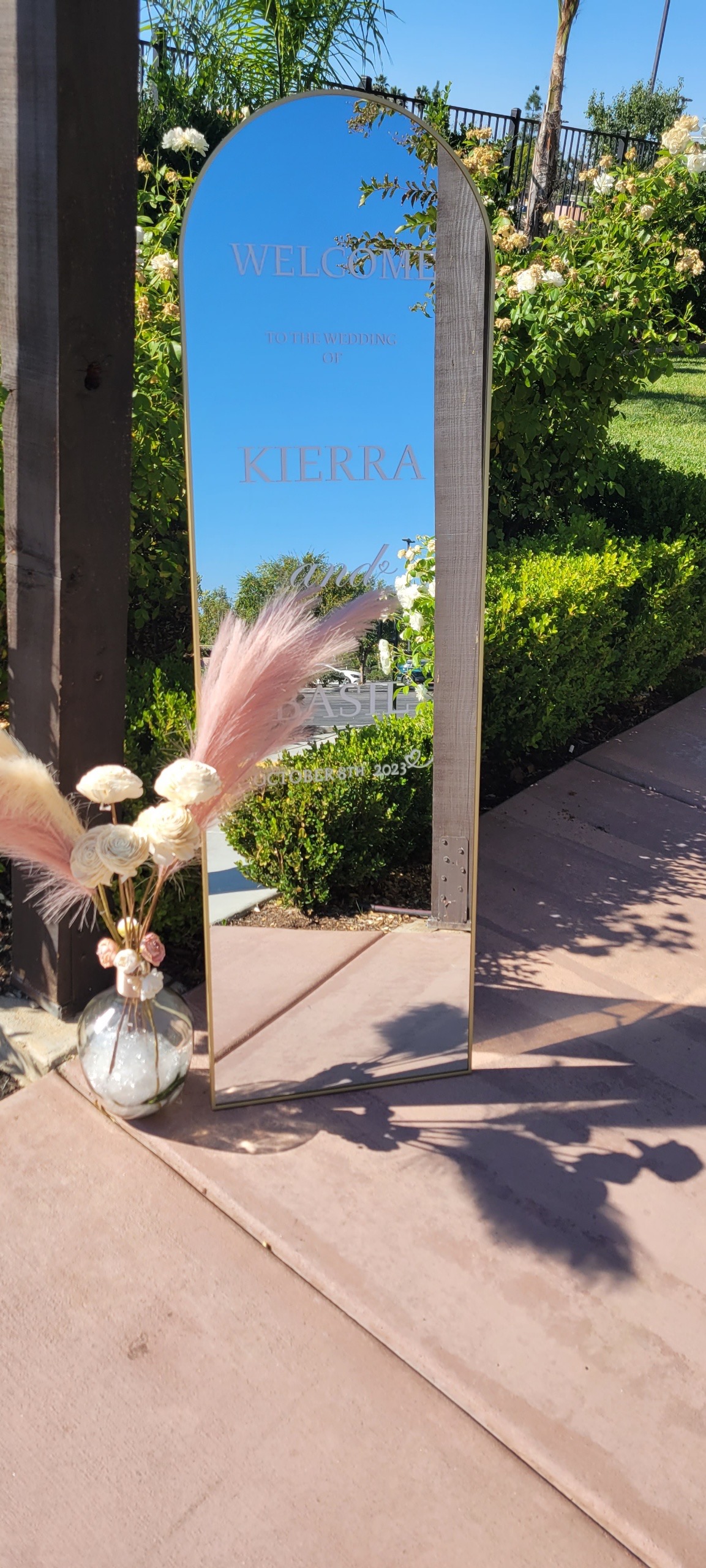 Mirrored outdoor wedding welcome sign